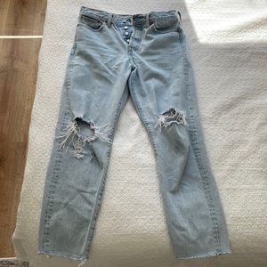 Levi’s 501 light wash jeans with knee distressing